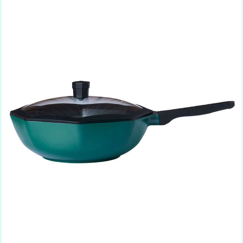 Nonstick teal frying pan with glass lid and black handle, modern kitchen cookware