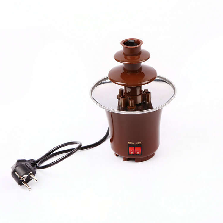 Electric chocolate fountain for kitchen with power cord and control switches on white background