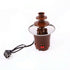 Electric chocolate fountain for kitchen with power cord and control switches on white background