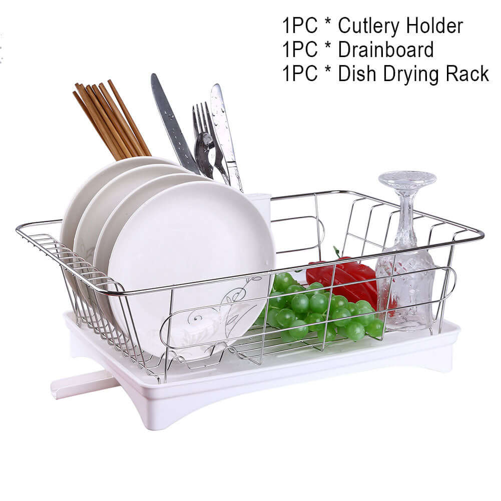 Metal dish drying rack with drainboard holding plates, cutlery, glasses, and kitchenware