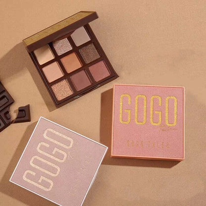 Eyeshadow palette with nine neutral shades, GOGO packaging, on a beige surface