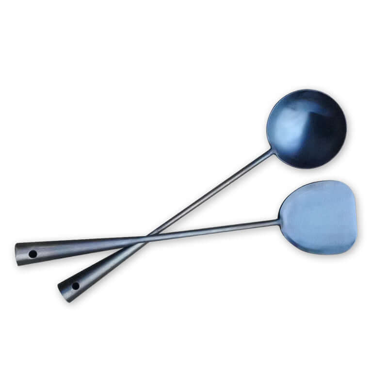 Stainless steel kitchen utensils set with ladle and spatula on white background