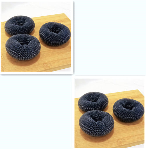 Set of three black mesh dish scrubbers on bamboo board, kitchen cleaning accessories