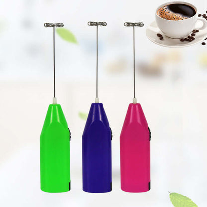Colorful electric milk frothers in green, purple, and pink with a cup of coffee