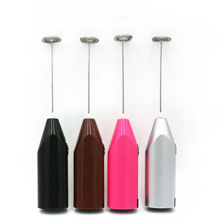 Four handheld milk frothers in black, brown, pink, and silver with stainless steel whisks