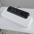 Electric vacuum sealer machine for food storage on white table, kitchen appliance