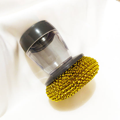 Clear soap dispenser dish brush with gold scrubber on white background, kitchen cleaning tool