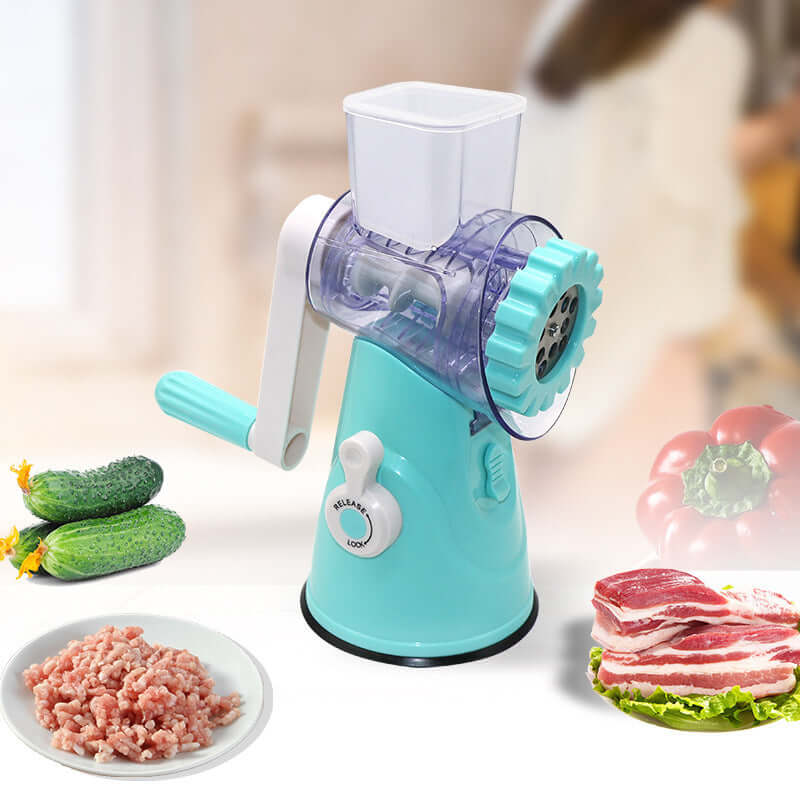 Manual meat grinder with handle, surrounded by cucumbers, minced meat, bacon, and bell pepper