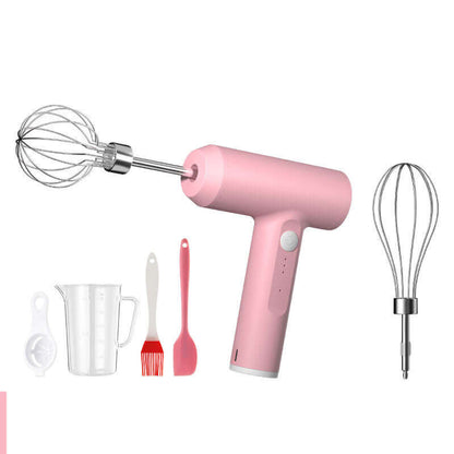 Pink handheld electric mixer with whisk, measuring cup, silicone brush, spatula, and egg separator