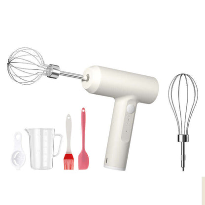 Electric hand mixer set with whisk attachments, measuring cup, spatula, and brush on white background