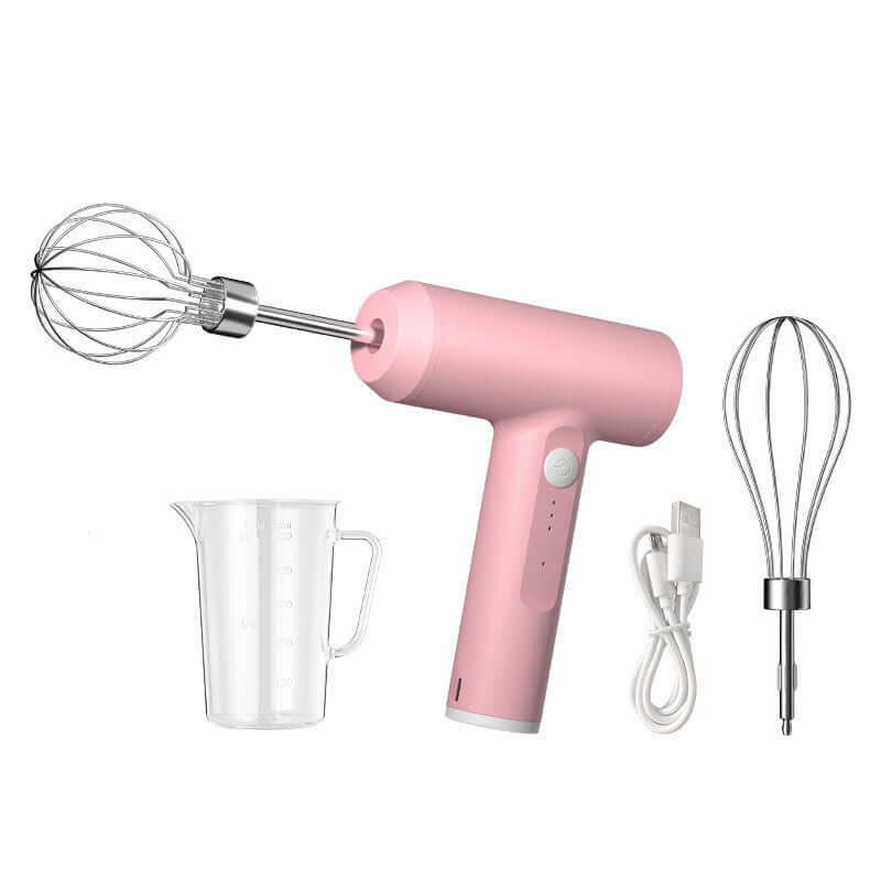 Pink handheld electric whisk mixer with two beaters, measuring cup, and USB charging cable