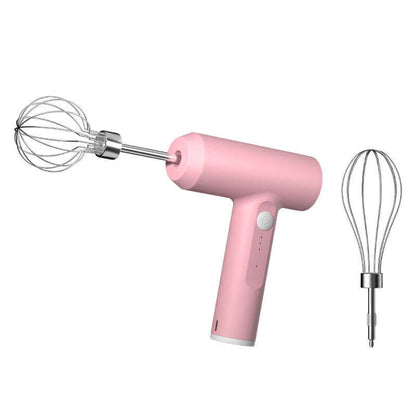 Pink handheld electric whisk mixer with two stainless steel attachments on white background