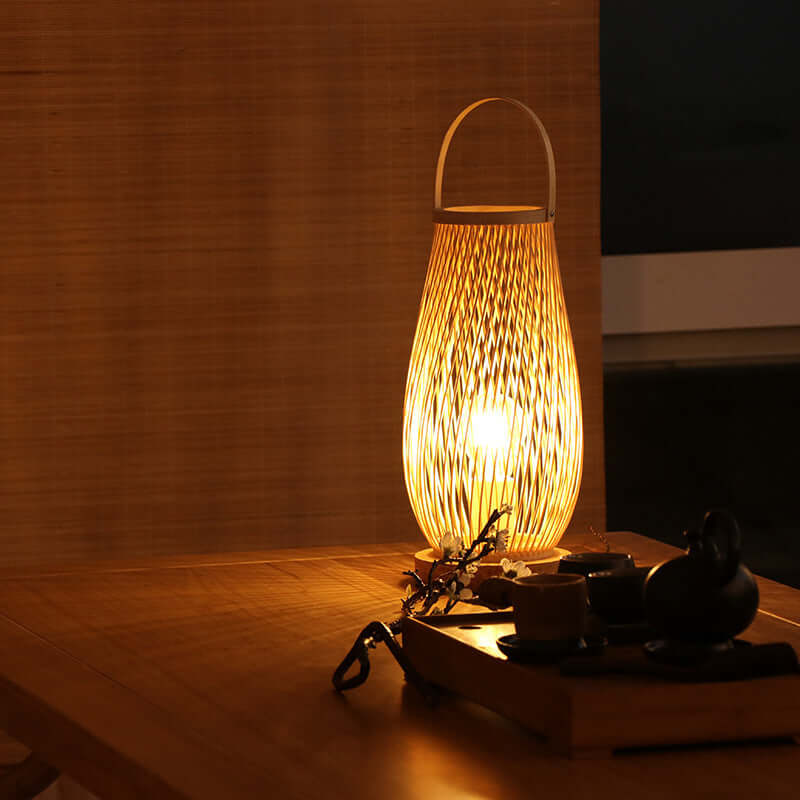 Modern decorative rattan table lamp with warm light on wooden kitchen table