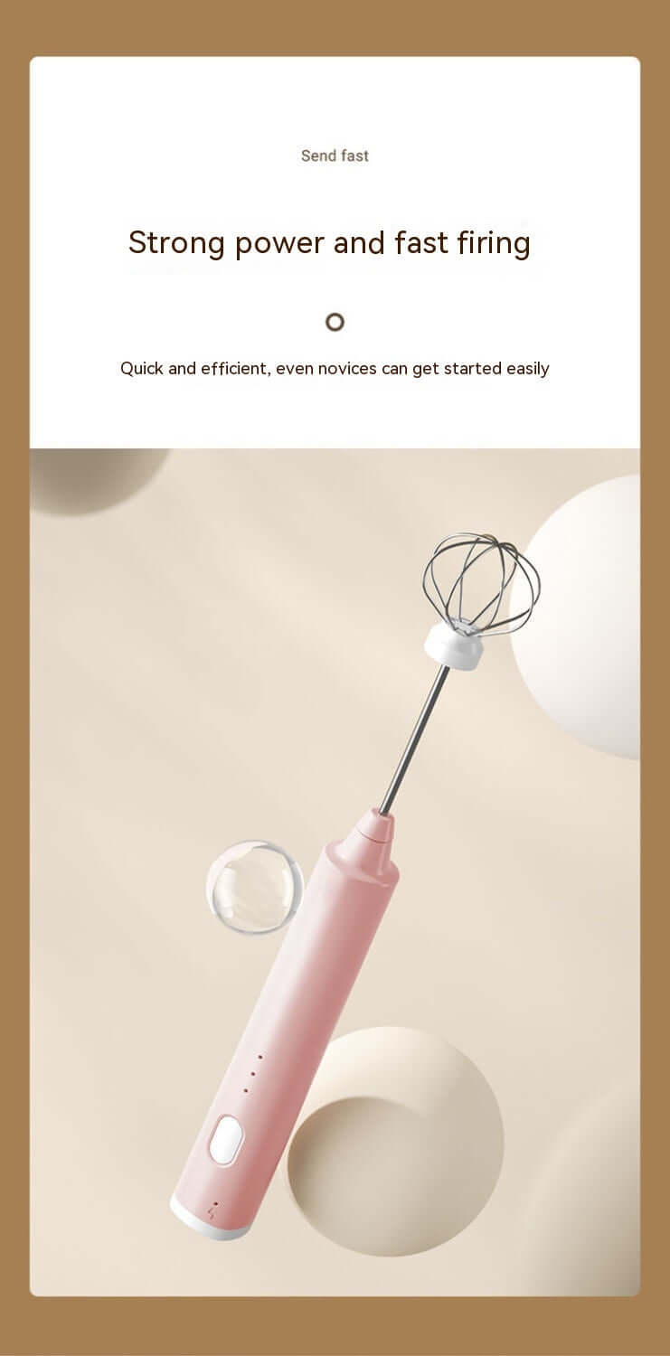 Pink handheld electric whisk for kitchen mixing and baking on a beige background.