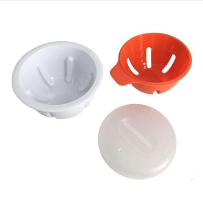 Plastic egg poacher cups with lids, white and orange kitchen utensil set on white background
