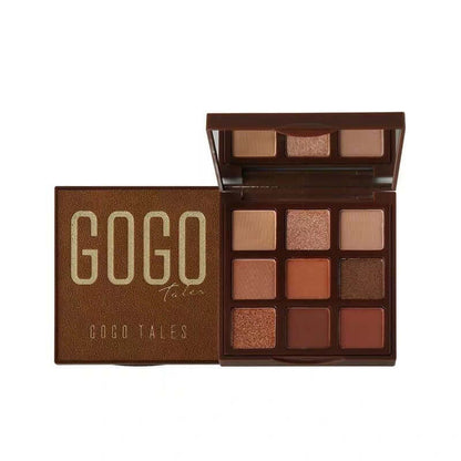 Brown eyeshadow palette with nine warm neutral shades and GOGO Tales branding on the lid