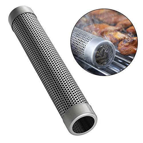 Stainless steel pellet smoker tube for BBQ grill smoking, shown in use with grilled meat.