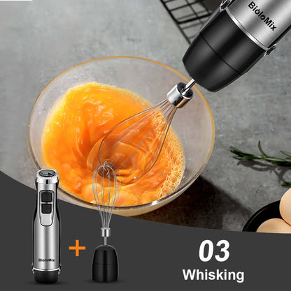 Electric hand mixer whisking eggs in a glass bowl, detachable whisk attachment shown