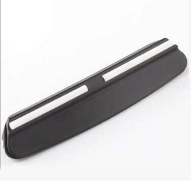Black magnetic knife holder with white magnetic strips for kitchen organization on white background