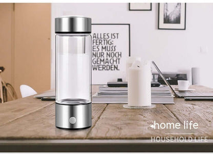 Modern electric blender bottle on a wooden kitchen table in a home setting
