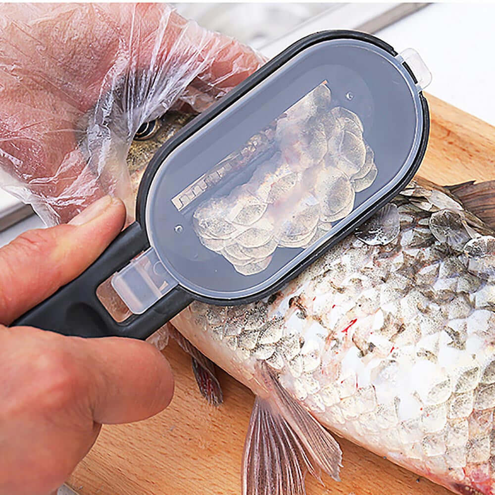 Hand using a fish scaler tool to remove scales from a fresh fish on a cutting board