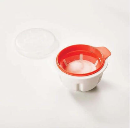 Microwave egg poacher with red interior and clear lid on white background