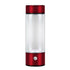 Red portable electric blender bottle with power button for kitchen use