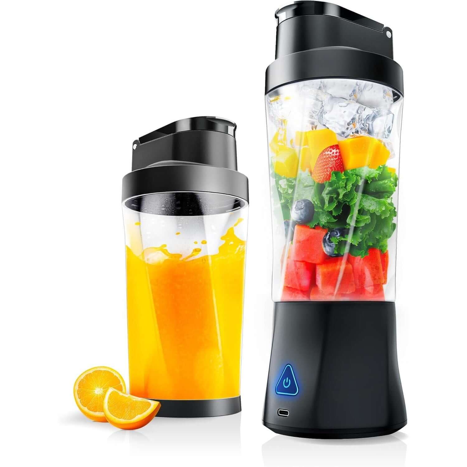Portable electric blender with lid, filled with fresh fruit and vegetables, next to smoothie cup and orange slices.