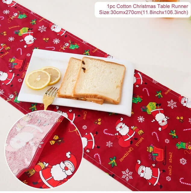 Cotton Christmas table runner with Santa print on dining table, bread and lemon slices on plate