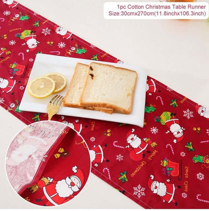Cotton Christmas table runner with Santa print on dining table, bread and lemon slices on plate