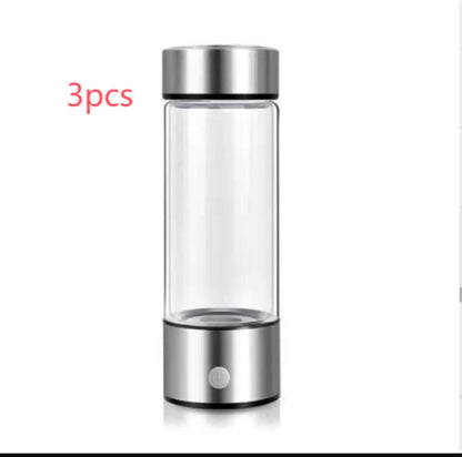 Stainless steel portable blender bottle with clear glass body, silver lid, and base, 3 pieces