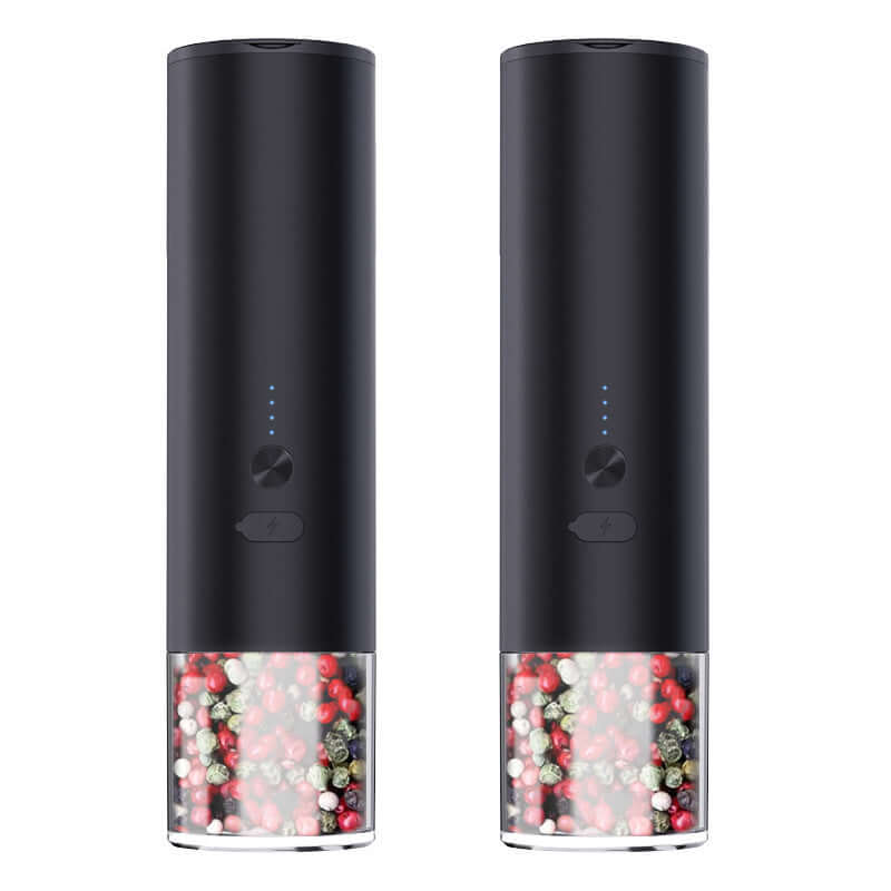 Pair of black electric pepper grinders with visible multi-colored peppercorns