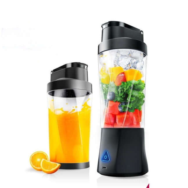 Portable blender with fruits and orange juice, kitchen appliance for smoothies