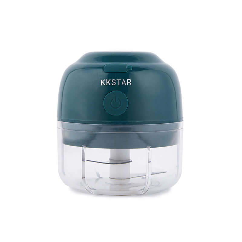 Compact electric mini food chopper with clear container and dark green lid for kitchen use