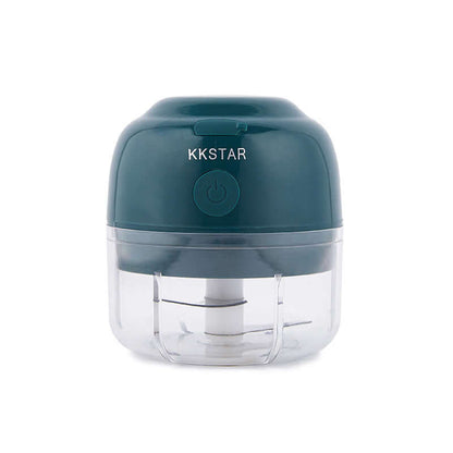 Compact electric mini food chopper with clear container and dark green lid for kitchen use