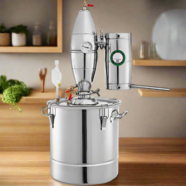 Stainless steel kitchen distiller with thermometer on a wooden countertop, modern kitchen background.
