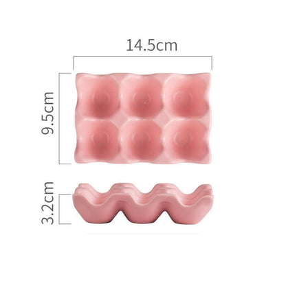 Pink plastic egg holder with 6 slots, dimensions labeled 14.5cm x 9.5cm x 3.2cm.