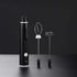 Electric handheld milk frother with whisk and beater attachments on black background