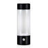 Portable electric blender bottle with black lid and base for kitchen use