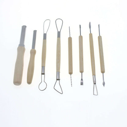 Set of wooden handle kitchen utensils and carving tools on white background