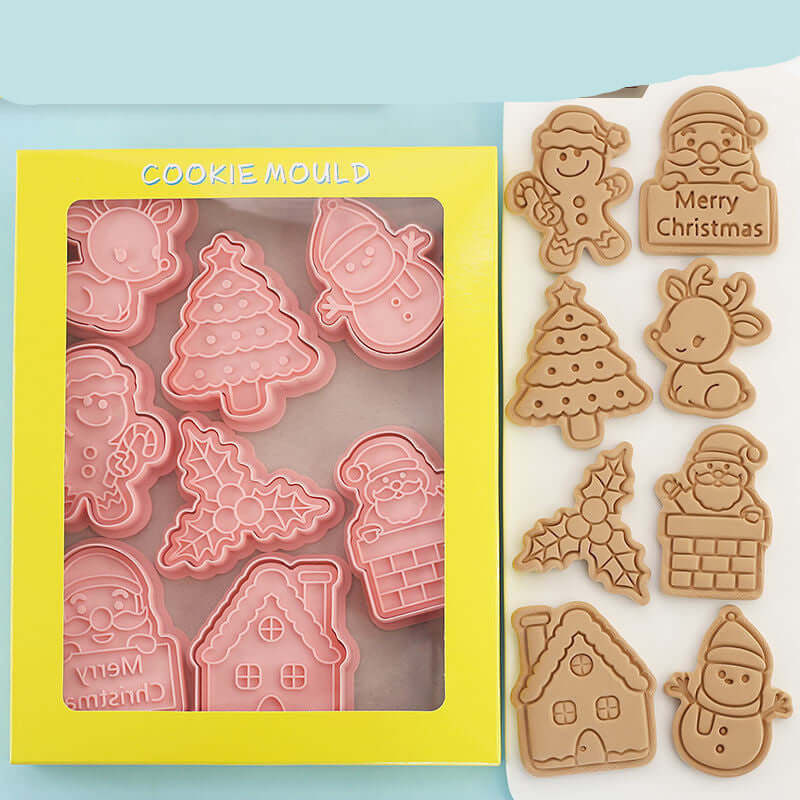 Christmas cookie cutters set with festive shapes and matching baked cookies on display