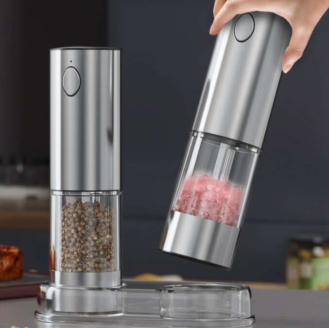 Stainless steel electric salt and pepper grinder set on kitchen counter