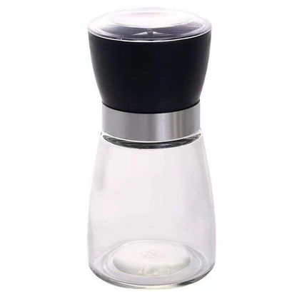 Modern glass and stainless steel spice grinder with black top for kitchen use