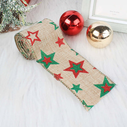 Burlap Christmas ribbon with red and green glitter stars, festive ornaments beside it