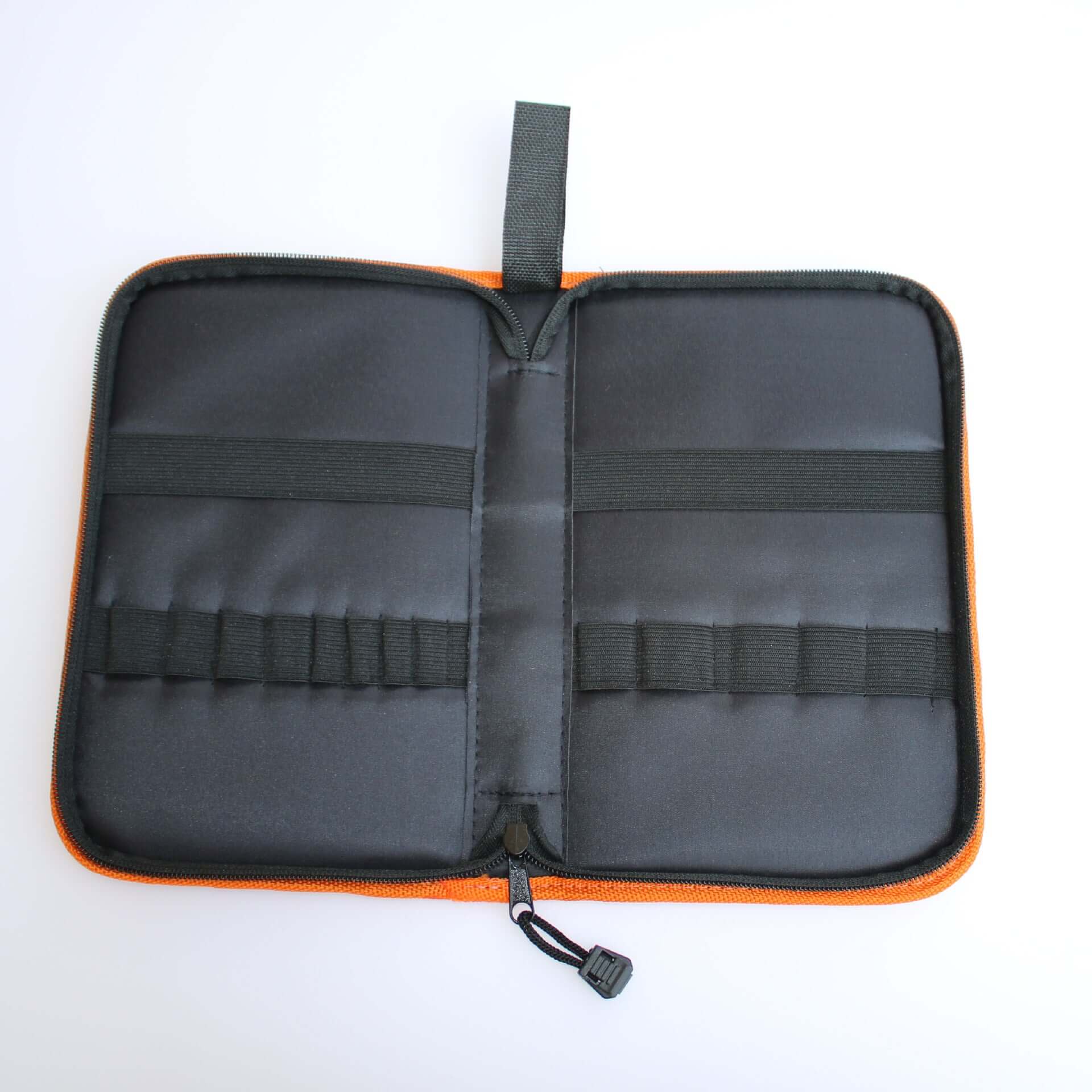 Open black utensil organizer case with elastic straps and zipper, kitchen accessory storage