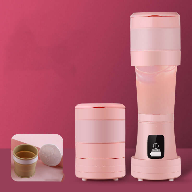 Collapsible pink portable electric kettle and cup set for kitchen or travel use against pink background