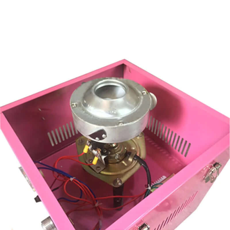Pink cotton candy machine heating element and motor assembly, kitchen appliance product.