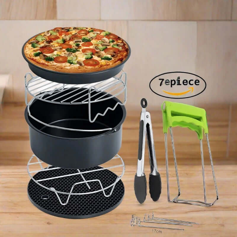 7-piece air fryer accessory set with racks, pan, pizza tray, tongs, and silicone mat on kitchen counter