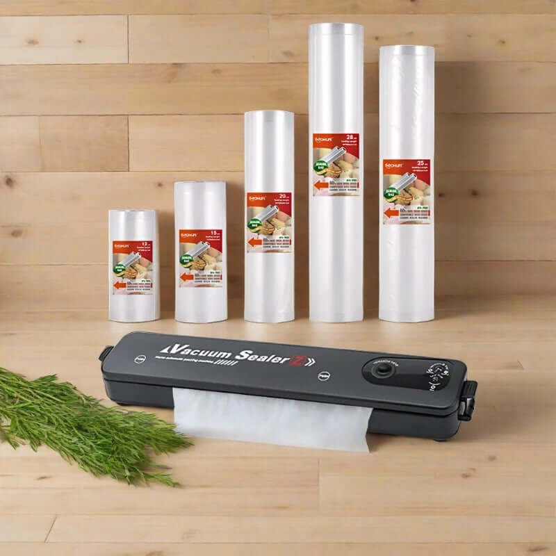 Vacuum sealer machine with assorted vacuum sealer bag rolls for kitchen food storage