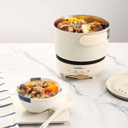 Electric cooker with hearty vegetable and meat stew on marble kitchen countertop